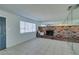 Living room with brick fireplace and entryway at 2108 Kirk Ave, Las Vegas, NV 89101