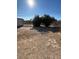 Empty lot with dirt and sparse vegetation at 217 Jackson Ave, Las Vegas, NV 89106