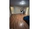 Spacious bedroom with laminate wood floor, and access to bathroom at 217 Jackson Ave, Las Vegas, NV 89106