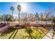 Neatly landscaped grassy area with trees and walkway at 2300 Silverado Ranch Blvd # 1070, Las Vegas, NV 89183