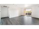 Spacious living room with gray vinyl plank flooring at 2300 Silverado Ranch Blvd # 1070, Las Vegas, NV 89183