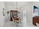 Bright dining room with chandelier, and view into kitchen at 2413 Hidden Glen Ct, Las Vegas, NV 89134