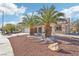 House exterior featuring a well-maintained front yard with palm trees at 2413 Hidden Glen Ct, Las Vegas, NV 89134