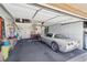 Attached garage with overhead storage and floor covering at 2413 Hidden Glen Ct, Las Vegas, NV 89134