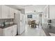 Modern kitchen with white cabinets and breakfast nook at 2413 Hidden Glen Ct, Las Vegas, NV 89134