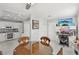 Modern kitchen with white cabinets, stainless steel appliances, and granite countertops at 2413 Hidden Glen Ct, Las Vegas, NV 89134