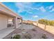 Landscaped backyard with flagstone patio and pathway at 2568 Dirleton Pl, Henderson, NV 89044