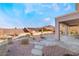 Landscaped backyard featuring a flagstone patio and pathway at 2568 Dirleton Pl, Henderson, NV 89044