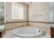 Relax in this bathroom's luxurious whirlpool tub at 2568 Dirleton Pl, Henderson, NV 89044