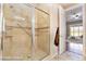 Bathroom featuring a spacious shower with glass doors and tile surround at 2568 Dirleton Pl, Henderson, NV 89044