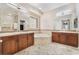 Large bathroom with double sinks, soaking tub, and tile floors at 2568 Dirleton Pl, Henderson, NV 89044