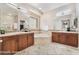 Elegant bathroom featuring dual vanities, a soaking tub, glass block window, and recessed lighting at 2568 Dirleton Pl, Henderson, NV 89044