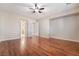 Bright bedroom featuring hardwood floors and ceiling fan at 2568 Dirleton Pl, Henderson, NV 89044