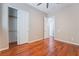 Bedroom with hardwood floors and double door closet at 2568 Dirleton Pl, Henderson, NV 89044