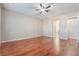 Bedroom with hardwood floors, ceiling fan and en-suite bathroom at 2568 Dirleton Pl, Henderson, NV 89044