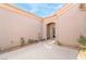 Private courtyard entry with mature rose bushes at 2568 Dirleton Pl, Henderson, NV 89044