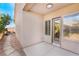 Covered patio with door access and view of landscaped backyard at 2568 Dirleton Pl, Henderson, NV 89044