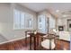 Bright dining area with wood floors and plantation shutters at 2568 Dirleton Pl, Henderson, NV 89044