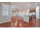 Bright dining room with hardwood floors and view to kitchen at 2568 Dirleton Pl, Henderson, NV 89044