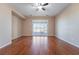 Living room with hardwood floors and sliding glass doors at 2568 Dirleton Pl, Henderson, NV 89044