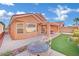 Backyard with patio, artificial turf and seating area at 2736 Mintlaw Ave, Henderson, NV 89044