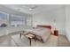 Main bedroom with bay window, ceiling fan and wood bench at 2736 Mintlaw Ave, Henderson, NV 89044