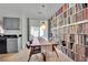 Bright dining area with wood table and extensive built-in shelving at 2736 Mintlaw Ave, Henderson, NV 89044