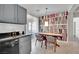 Kitchen dining area with wood table and built-in shelving at 2736 Mintlaw Ave, Henderson, NV 89044