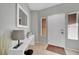 Bright entryway with tiled floor, white console table, and mirror at 2736 Mintlaw Ave, Henderson, NV 89044