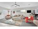 Spacious living room with beige sofa and orange accent chair at 2736 Mintlaw Ave, Henderson, NV 89044