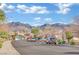 Quiet residential street with mountain views and parked cars at 2736 Mintlaw Ave, Henderson, NV 89044