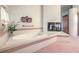 Bathroom with large bathtub, fireplace, and pink tile at 3128 Pelican Beach Dr, Las Vegas, NV 89117