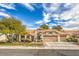 Single-story home with landscaped yard and two-car garage at 3128 Pelican Beach Dr, Las Vegas, NV 89117