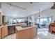 Kitchen island with cooktop and views into adjacent Gathering room at 3128 Pelican Beach Dr, Las Vegas, NV 89117