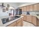 Spacious kitchen with light wood cabinets and modern appliances at 3128 Pelican Beach Dr, Las Vegas, NV 89117