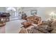 Living room with ornate furniture and a large window at 3128 Pelican Beach Dr, Las Vegas, NV 89117