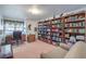 Spacious home office with large bookcases and comfortable seating at 3128 Pelican Beach Dr, Las Vegas, NV 89117