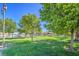 Community park with grassy areas, mature trees, and a gazebo at 3128 Pelican Beach Dr, Las Vegas, NV 89117