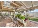 Relaxing patio area with seating, ceiling fan, and pergola at 3128 Pelican Beach Dr, Las Vegas, NV 89117