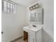 Small bathroom with white vanity and mirror at 3217 Joann Way, Las Vegas, NV 89108