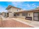 Exterior view of a building with a walkway and seating area at 3217 Joann Way, Las Vegas, NV 89108