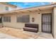 Exterior view of the building's entrance with a bench at 3217 Joann Way, Las Vegas, NV 89108