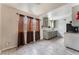 Kitchen with gray cabinets, tile floor, and a stove at 3217 Joann Way, Las Vegas, NV 89108