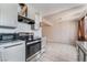 Kitchen with gray cabinets, stainless steel appliances, and tile floors at 3217 Joann Way, Las Vegas, NV 89108