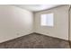 Simple bedroom with carpet and window at 332 S Buffalo Dr # 202, Las Vegas, NV 89145