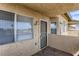 Private condo entry with security door and blinds at 332 S Buffalo Dr # 202, Las Vegas, NV 89145