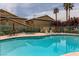 Inviting community pool with lounge chairs and patio area at 332 S Buffalo Dr # 202, Las Vegas, NV 89145