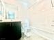 Clean bathroom with dark vanity, toilet and bathtub at 340 Banished Ave # 2, North Las Vegas, NV 89031