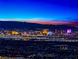 Stunning night-time panoramic view of the city skyline against a colorful twilight sky and mountain backdrop at 371 Tranquil Peak Ct, Henderson, NV 89012