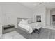 Spacious bedroom with a king-size bed, accent lighting and adjoins an ensuite bathroom at 371 Tranquil Peak Ct, Henderson, NV 89012